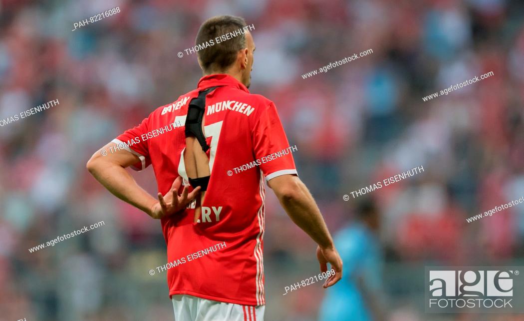 Stock Photo: Munich's Franck Ribery seen with a ripped jersey during an international soccer friendly match between FC Bayern Munich and Manchester City at the Allianz Arena.