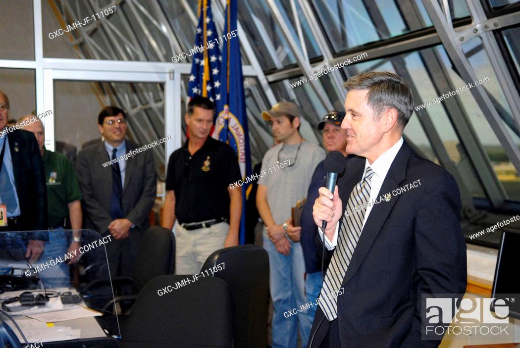 Stock Photo: In Firing Room 4 of NASA Kennedy Space Center's Launch Control Center, Kennedy Director Bob Cabana congratulates the launch team upon the successful launch of.