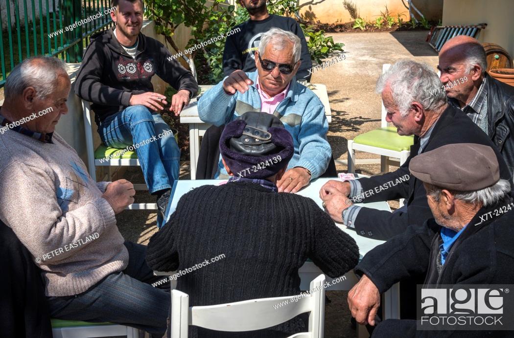 Stock Photo: Playing card at a cafe in Ksamil in Southern Albania.