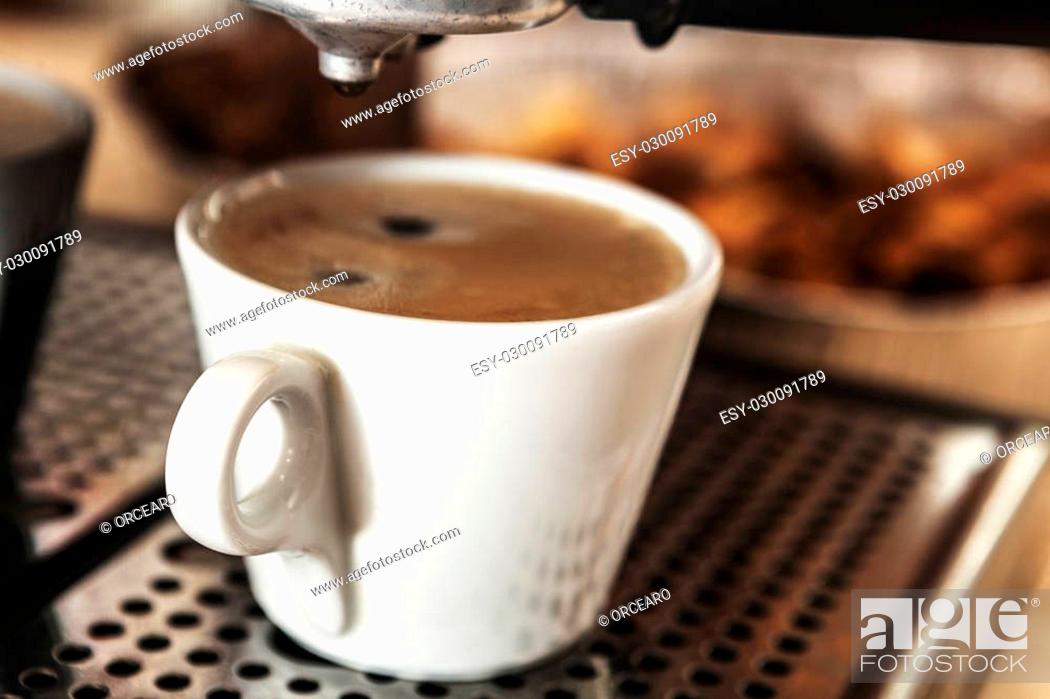 Stock Photo: White cup filled with some delicious coffee.