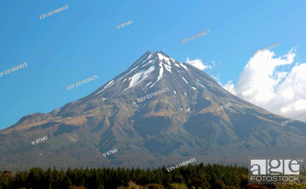 Stock Photo: Mt Egmont, aka Mt Taranaki, near New Plymouth in New Zealand. It is unusual to see this mountain - it is normally covered in cloud or rain! It was the.