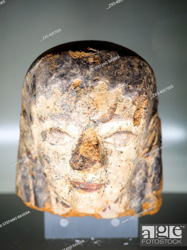 Photo de stock: Terracotta antefix in female head with face with long eyes to hair with short wavy locks 530 BC - National Etruscan Museum of Villa Giulia - Rome, Italy.