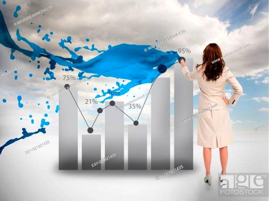 Stock Photo: Creative businesswoman drawing a chart with paint splash.