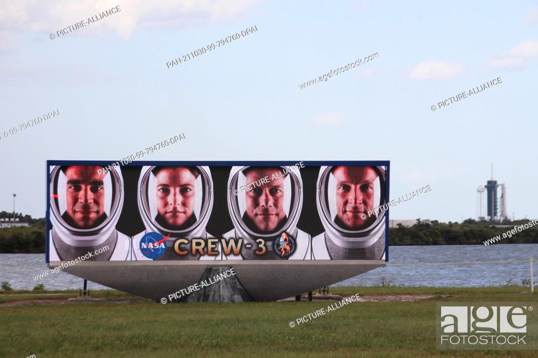Stock Photo: 29 October 2021, US, Cape Canaveral: A video screen shows the faces of the four astronauts of Crew-3 (l-r): Raja Chari, Kayla Barron.