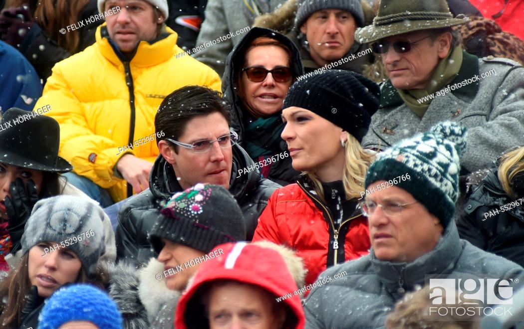 Stock Photo: Former competitive skier Maria Hoefl-Riesch and her husband Marcus Hoefl (C) sits in the stands at the Hahnenkamm Race in Kitzbuehel, Austria, 24 January 2015.