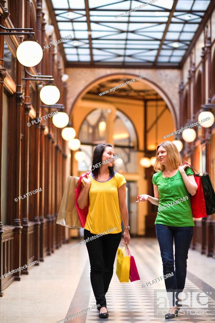 Stock Photo: Pair of young women shopping.