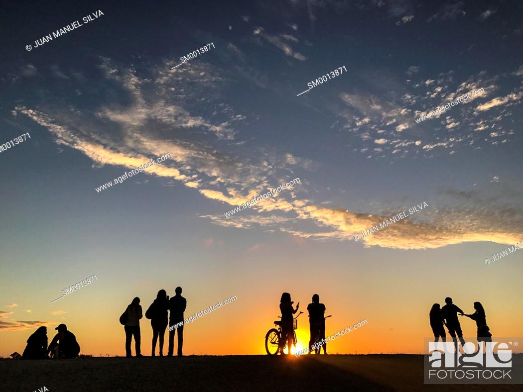 people-looking-at-sunset-on-levee-of-everglades-national-park-florida-usa