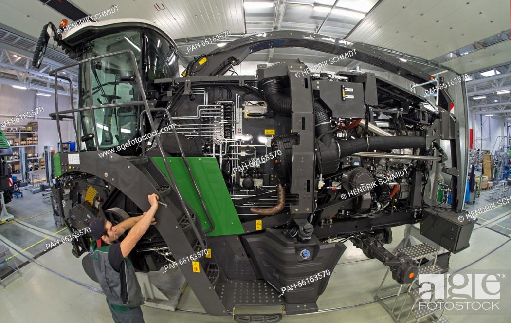 Stock Photo: AGCO GmbH employees assemble the Katana model in the production hall for corn choppers by Fendt in Hohenmoelsen,  Germany, 25 February 2016.