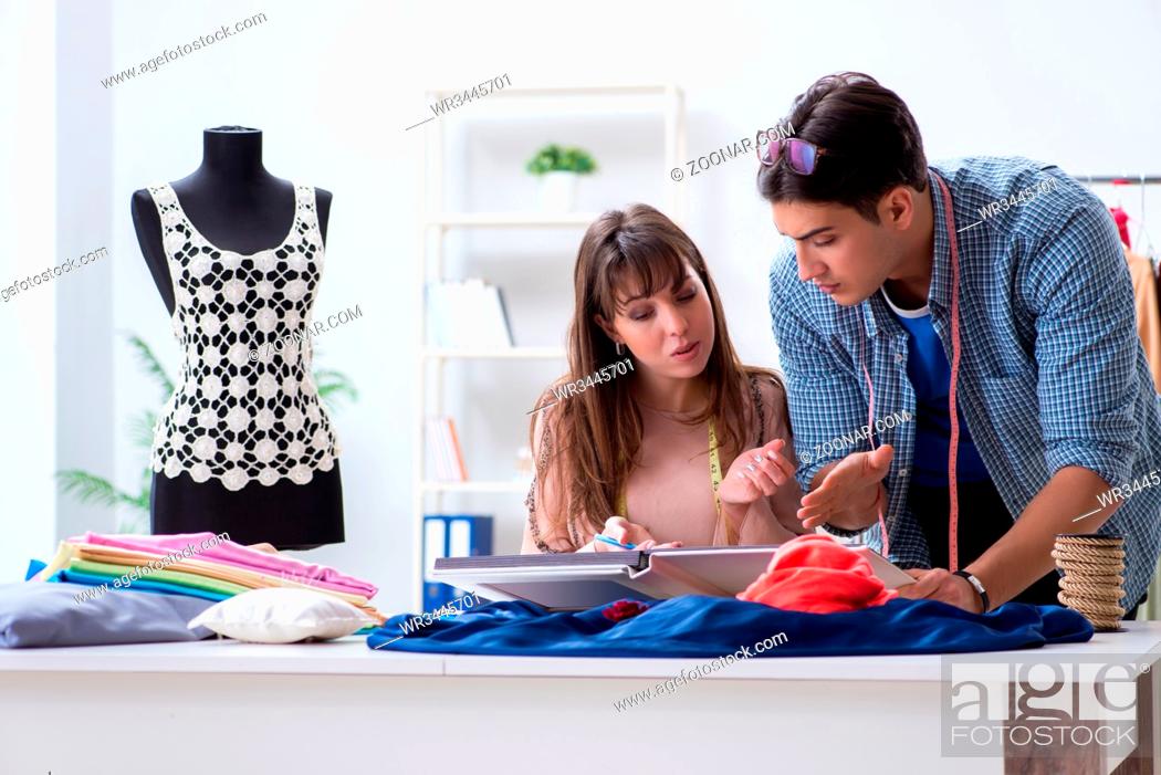 Stock Photo: Male tailor with female student in workshop.