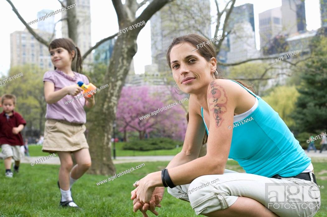 Stock Photo: A woman and her children in Central Park, New York City.