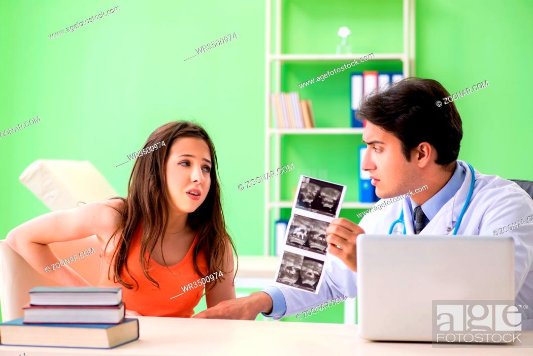 Stock Photo: Pregnant woman visiting male gynecologyst at the clinic.