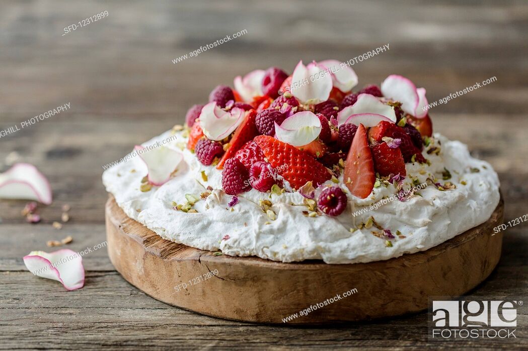Stock Photo: Pavlovas, Edible, Eatable, Pistachio, Raspberry, Series, Sweeten, Recipe, Selective Focus, Copy Space, Ready-To-Eat, Food And Drink, Fragaria X Ananassa, Rose, Rubus Idaeus, Pavlova, Strawberry, Meringue, Focus On Foreground, Fragaria, Indoors, Interior, Afters, Flower, Inside, Backgrounds, Wooden, Food, Plant, Soft