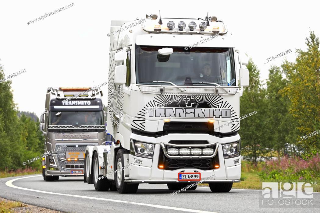 Stock Photo: Lempaala, Finland. August 8, 2019. Black and white customized Renault Trucks T lorry and Volvo FH of Transmito Oy in convoy to Power Truck Show 2019.