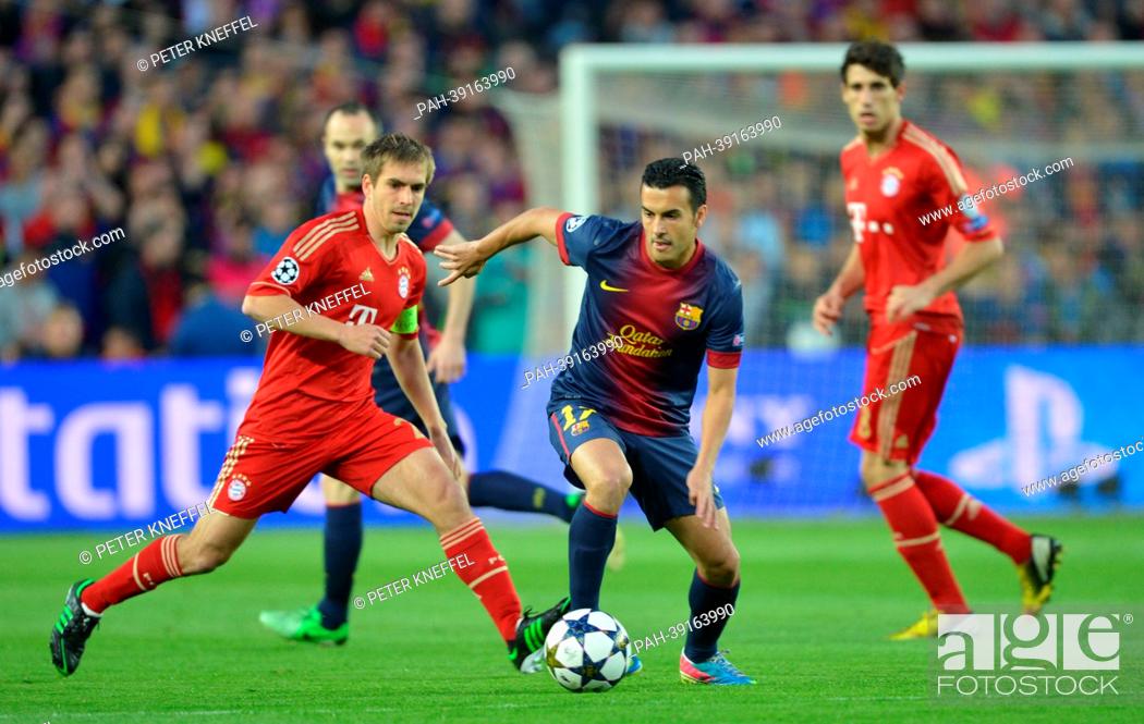 Stock Photo: Barcelona's Pedro Rodriguez (C) and Munich's Philipp Lahm (L) vie for the ball during the UEFA Champions League semi final second leg soccer match between FC.