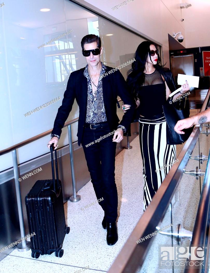 Stock Photo: Perry Farrell and his wife Etty Lau depart from Los Angeles International Airport (LAX) Featuring: Perry Farrell, Etty Lau Farrell Where: Los Angeles.