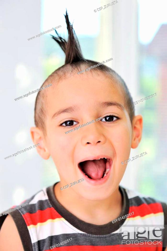 Cute little boy with funny hair and grimace, Stock Photo, Picture And Low  Budget Royalty Free Image. Pic. ESY-014250517 | agefotostock