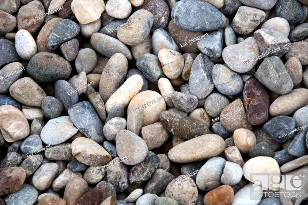 Stock Photo: grid gravel background with different shapes of rocks.