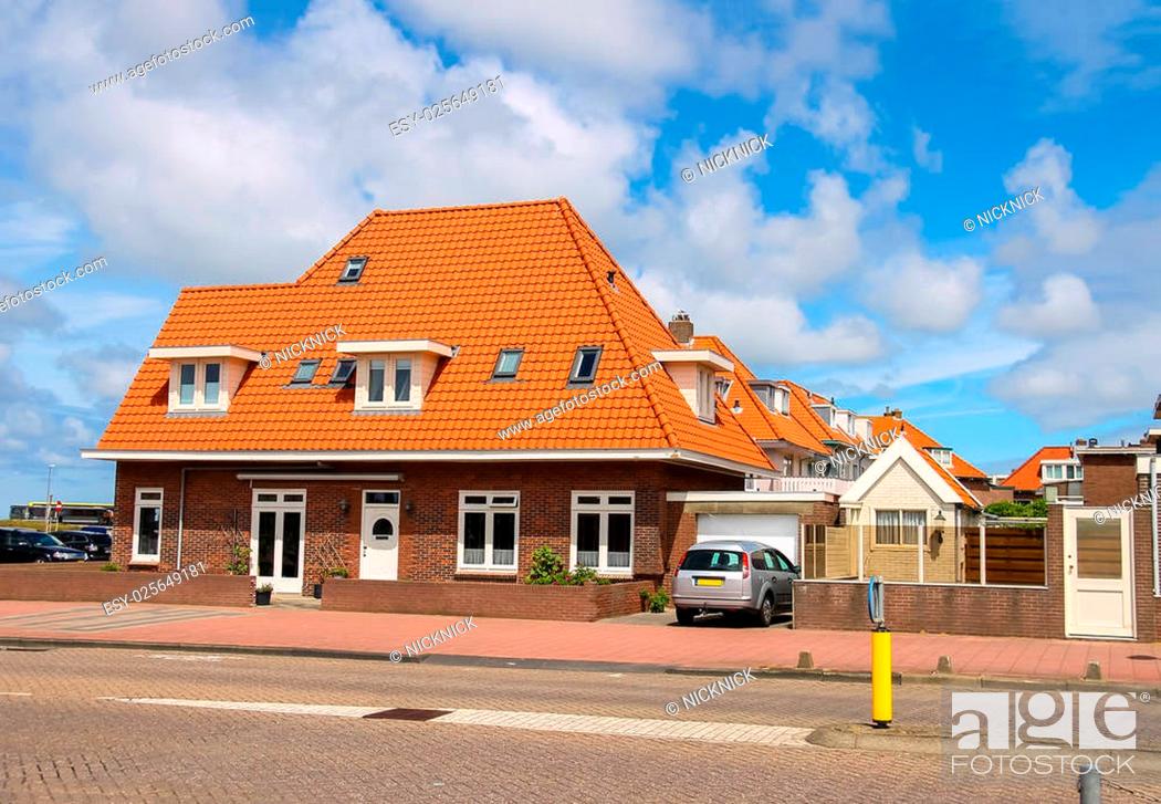 Stock Photo: An auto is standing near the residential house in the center of town. Zandvoort aan Zee is a main sea resort and touristic center with a long sandy beach.