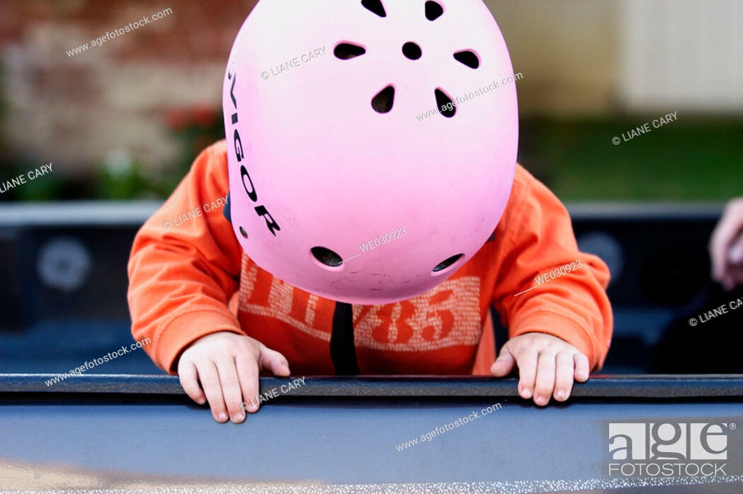 Stock Photo: Toddler wearing bike helmet.