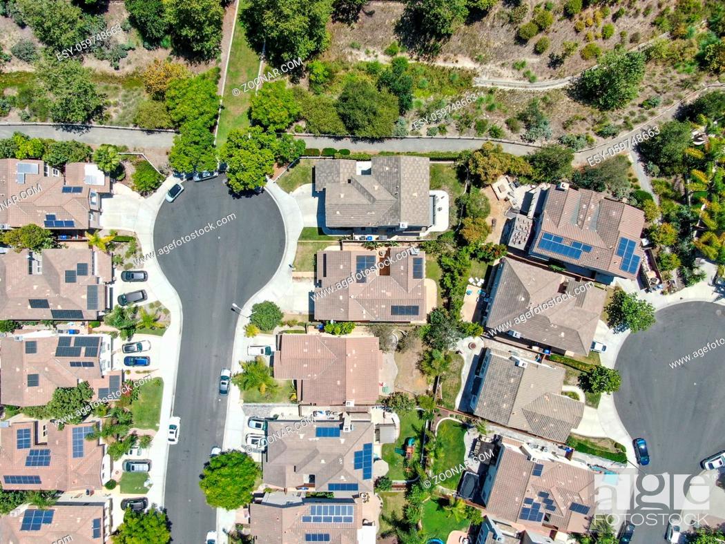 Stock Photo: Aerial top view of middle class residential villas with solar panel on the roof, San Diego County, California, USA.