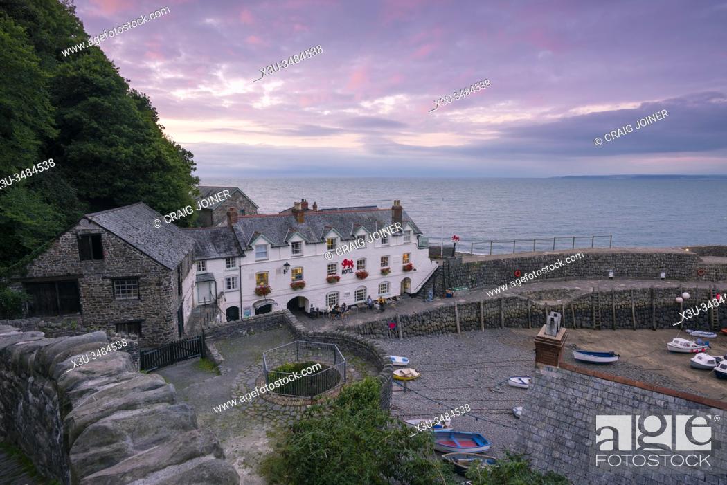 Stock Photo: The harbour village of Clovelly on the North Devon coast and Bideford Bay beyond, England.