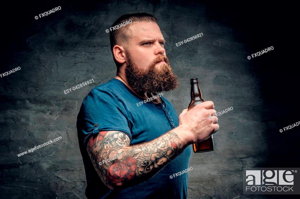 Fat bearded men with tattoos on arm holds beer bottle, Stock Photo, Picture  And Low Budget Royalty Free Image. Pic. ESY-042856921 | agefotostock