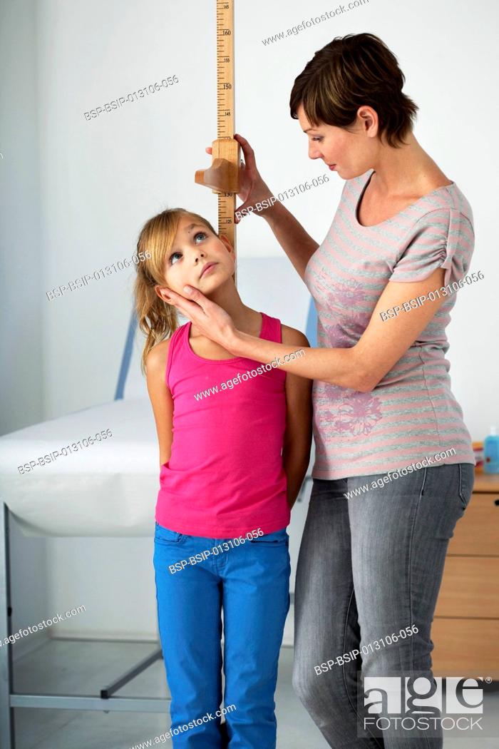 Stock Photo: MEASURING HEIGHT IN A CHILD.