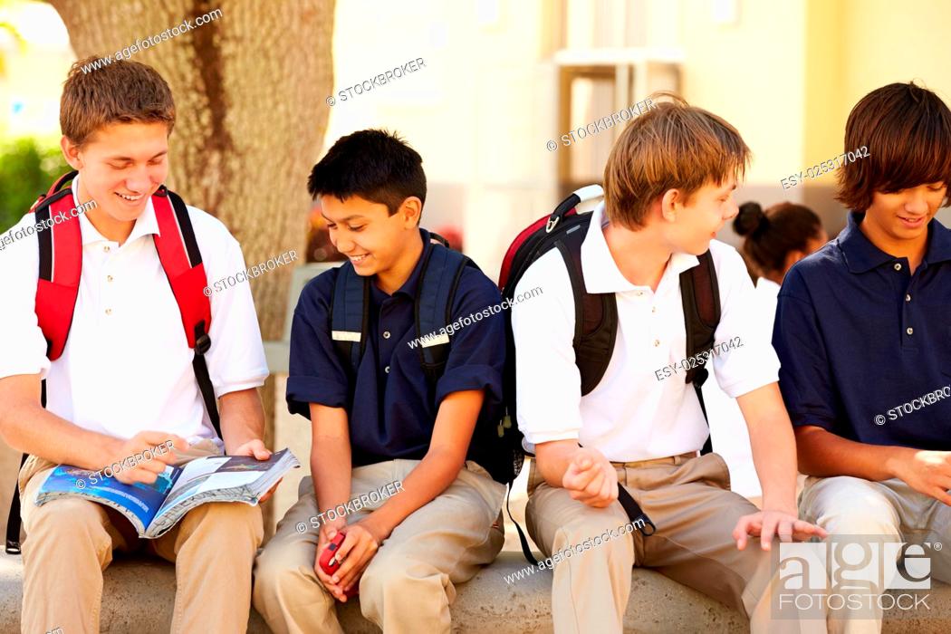 Stock Photo: Male High School Students Hanging Out On School Campus.