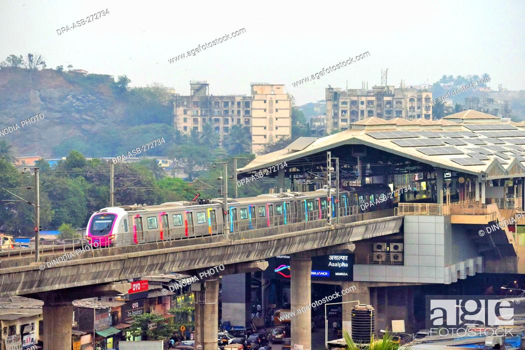 Stock Photo: Metro train near Asalpha railway station, Mumbai, Maharashtra, India, Asia.