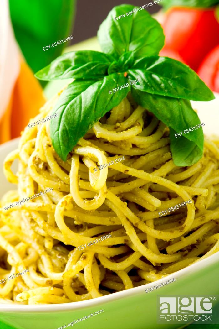 Photo de stock: photo of delicious italian pasta with pesto sauce.