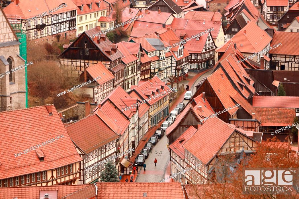 Stock Photo: ILLUSTRATION - 02 January 2022, Saxony-Anhalt, Stolberg: View of the roofs of old half-timbered houses in the Harz village of Stolberg.