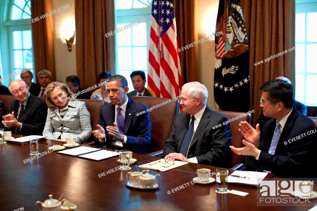 President Barack Obama And Cabinet Members Applaud Defense