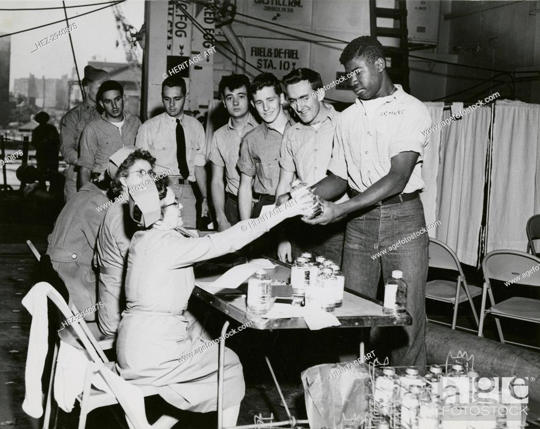 Stock Photo: Crew members of the USS Lake Champlain (CVA-39) participating in the ship's two day.., 20604. Creator: United States Navy.