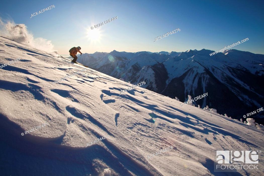 Stock Photo: A backcountry skier skis through windslab in the Kicking Horse Backcountry, Golden, Britsh Columbia, Canada.