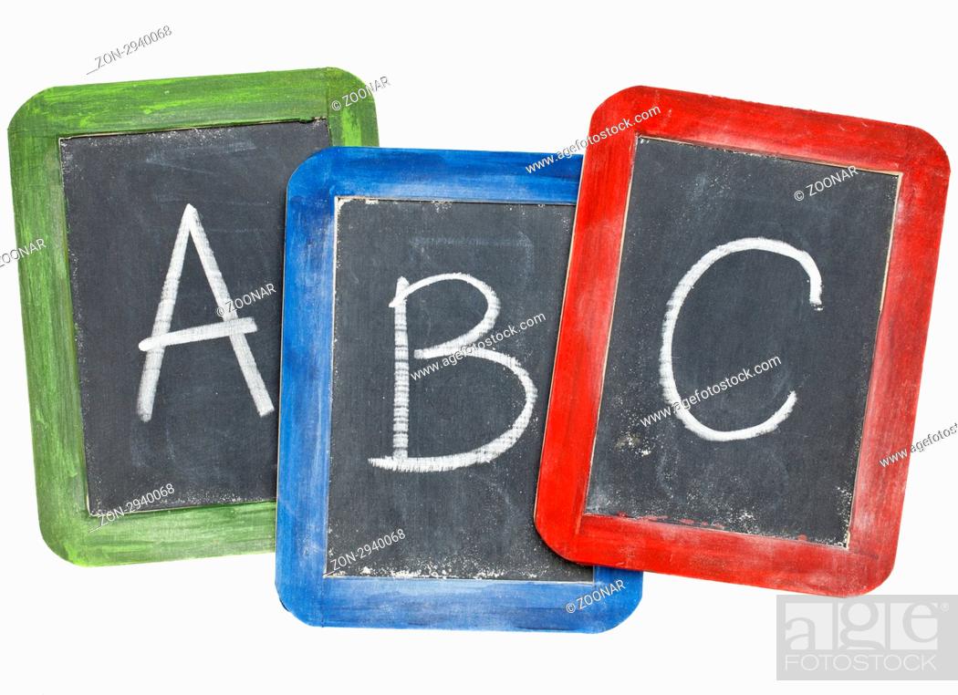 Stock Photo: first letters of alphabet A, B, C in white chalk handwriting on three small slate blackboards.