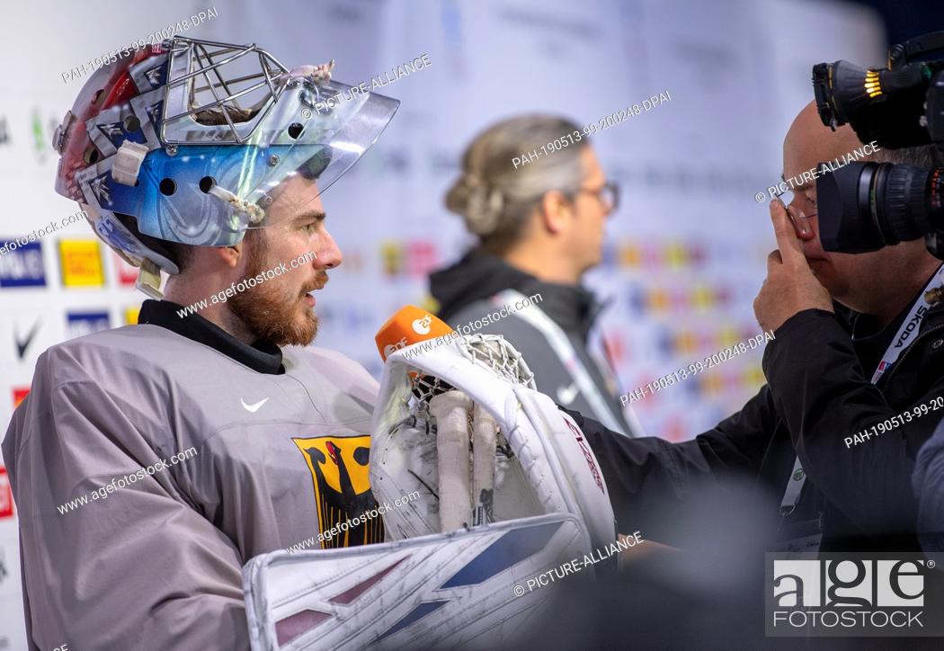 Stock Photo: 13 May 2019, Slovakia, Kosice: Ice Hockey World Championship: Germany's goalkeeper Philipp Grubauer talks to journalists after training.