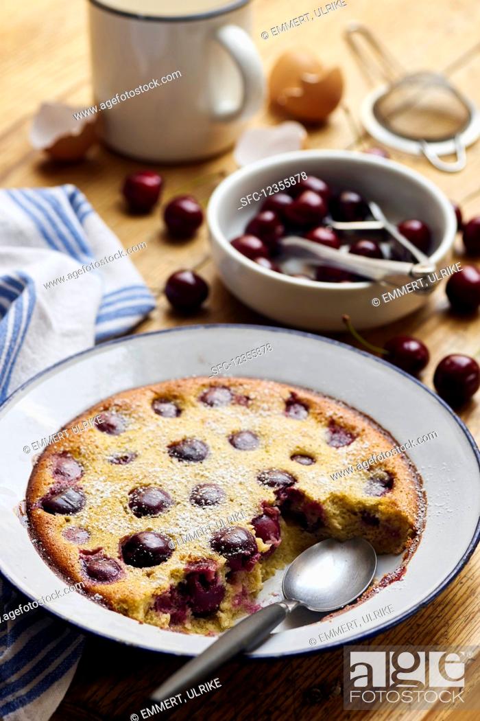 Stock Photo: Cherry clafoutis on a rustic wooden table.