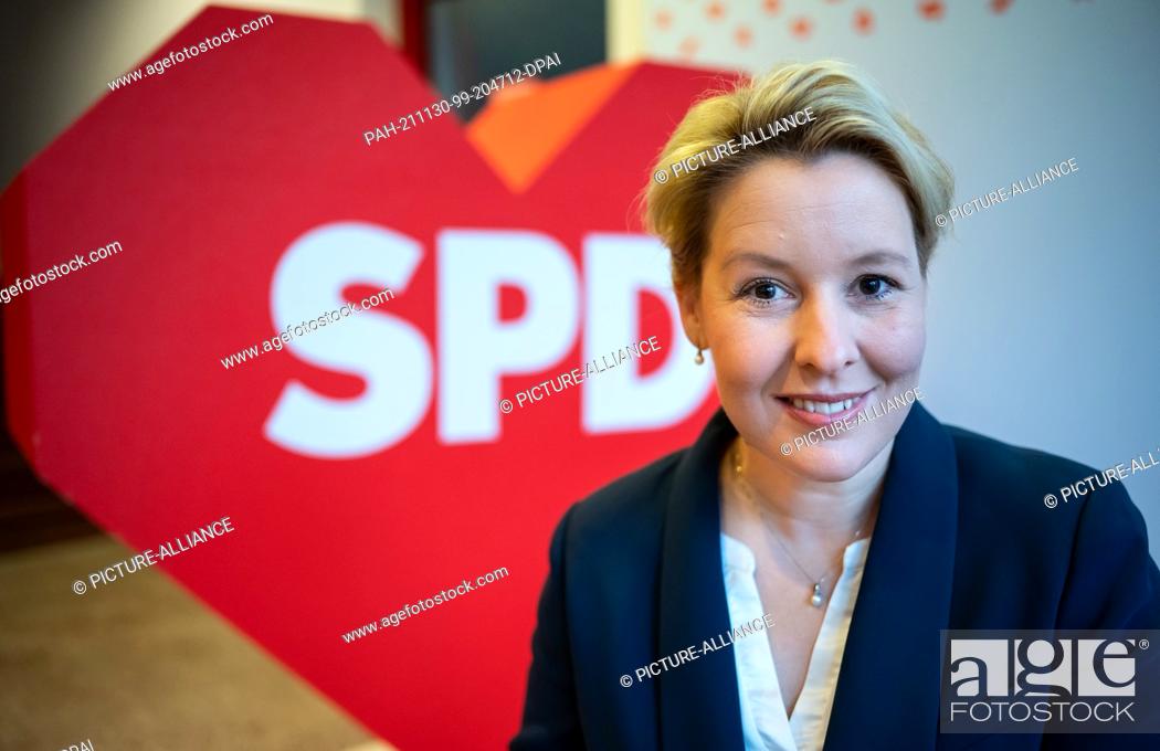 Stock Photo: 30 November 2021, Berlin: Franziska Giffey, leader of the Berlin SPD and designated governing mayor of Berlin, sits in front of a red heart with the inscription.