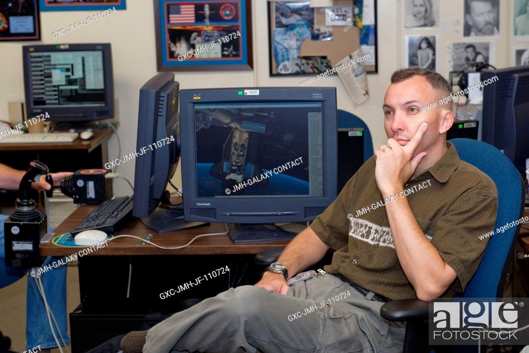 Stock Photo: Astronaut Randy Bresnik, STS-129 mission specialist, is pictured during a training session in the virtual reality lab in the Space Vehicle Mock-up Facility at.