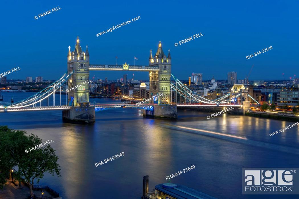 Stock Photo: View of Tower Bridge and River Thames from Cheval Three Quays at dusk, London, England, United Kingdom, Europe.