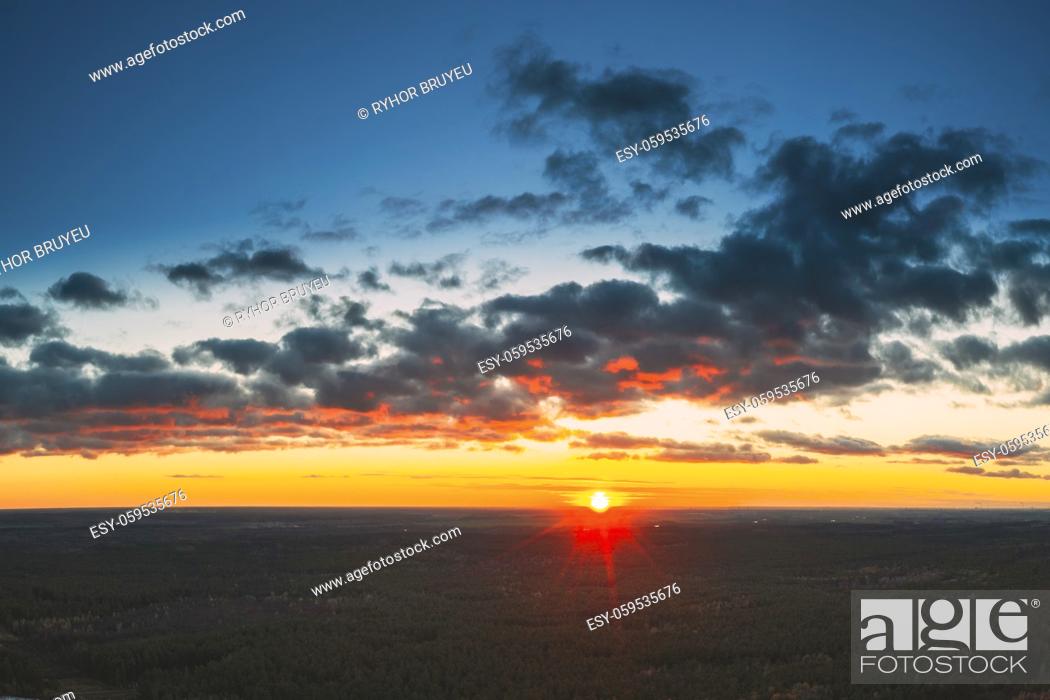 Stock Photo: Aerial View Of Sunshine In Sunrise Bright Dramatic Sky. Scenic Colorful Sky At Dawn. Sunset Sky Above Forest Landscape In Evening.