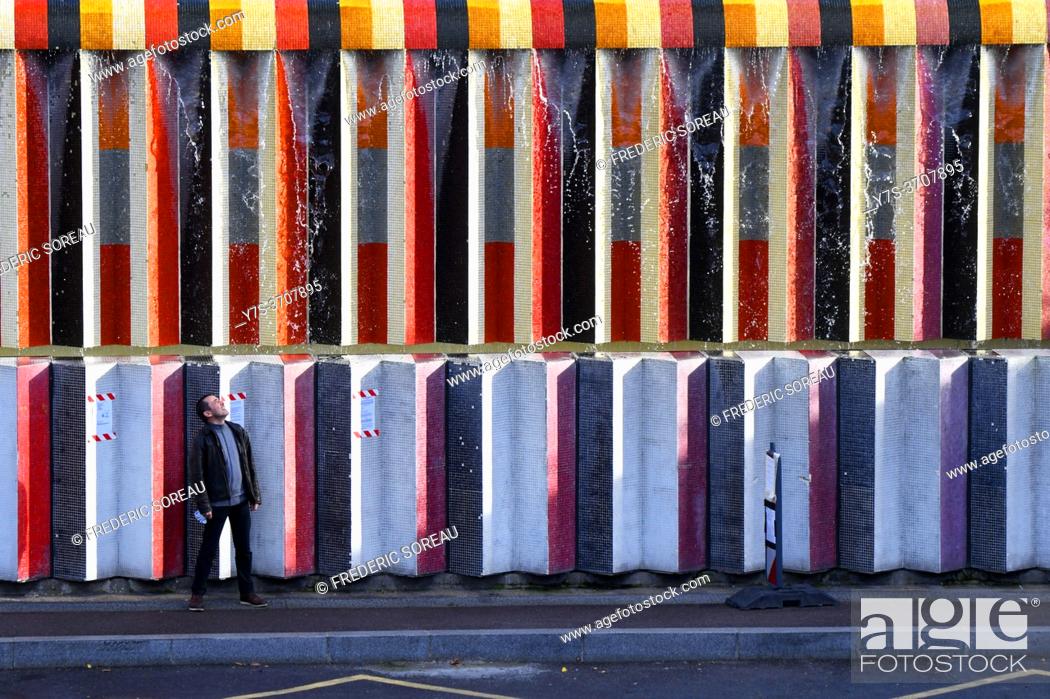 Stock Photo: Wall of fountain covered in mosaic tiles by Israeli artist Yaacov Agam, in the La Defense area in Paris, France.