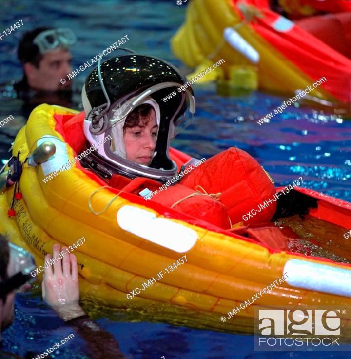 Stock Photo: Astronaut Ellen Ochoa, mission specialist, has just deployed her life raft during emergency bailout training with her STS-96 crew mates.