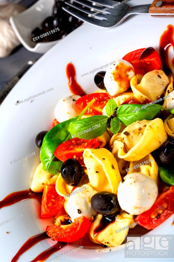 Stock Photo: rustic tortellini pasta salad with mozzarella.