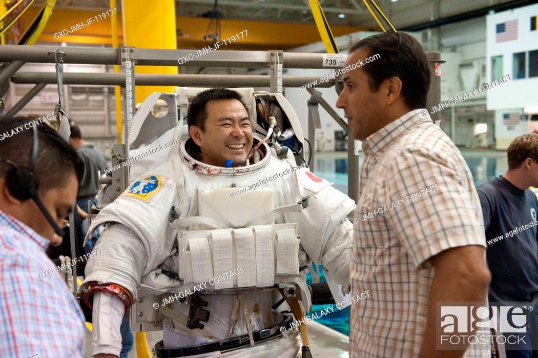 Stock Photo: Japan Aerospace Exploration Agency (JAXA) astronaut Akihiko Hoshide, Expedition 3233 flight engineer, attired in a training version of his Extravehicular.