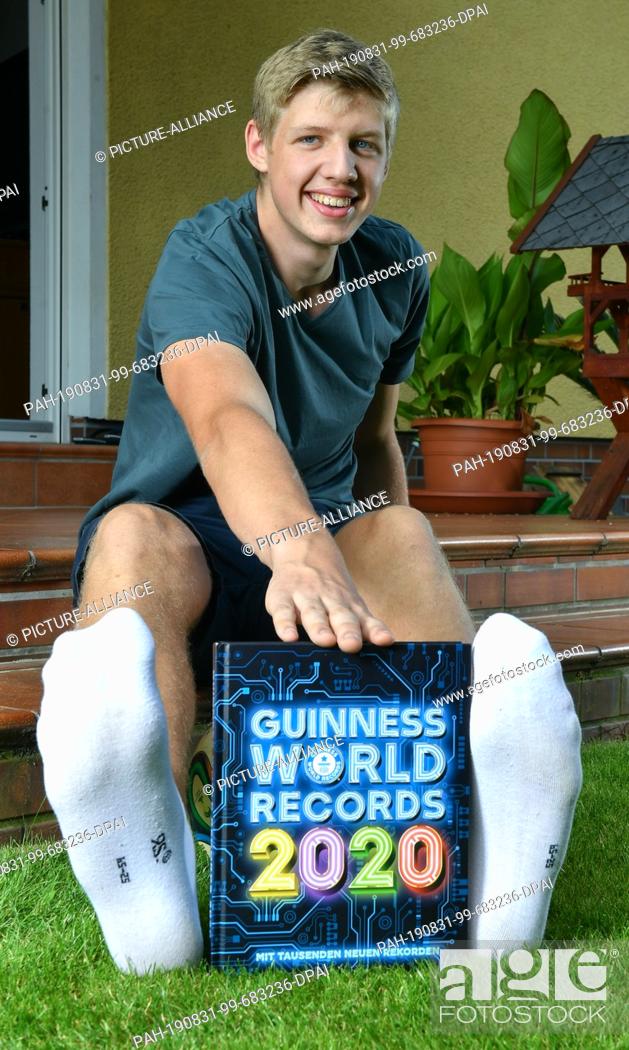 Stock Photo: 24 August 2019, Berlin: 16-year-old Lars Motza from Berlin is the teenager with the longest feet in the world. He can be found in the new Guinness Book of.