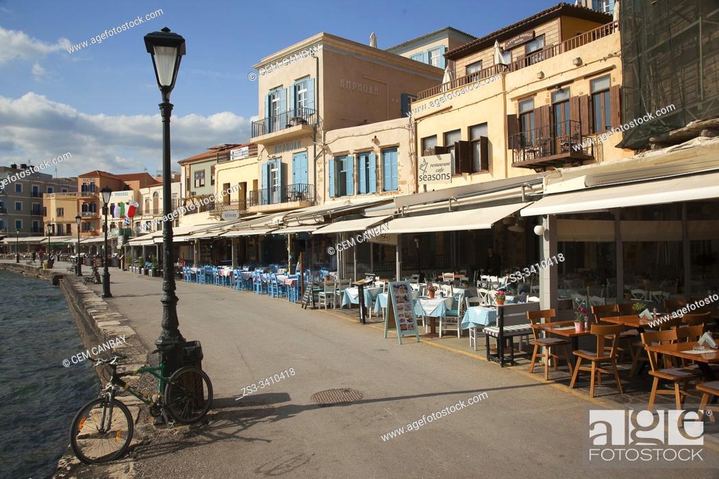 Stock Photo: View to the traditional houses by the sea at the harbor, Chania, Crete, Greek Islands, Greece, Europe.