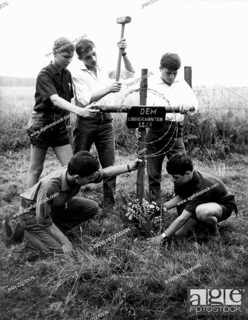 Stock Photo: Pupils construct a cross in Schegeiss in the Oberharz in memory of a refugee who was shot down the day before attempting to cross the German-German border.