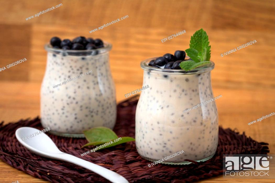 Stock Photo: Healthy breakfast or morning snack with chia seeds vanilla pudding and blueberries. vegetarian food, diet and health concept.
