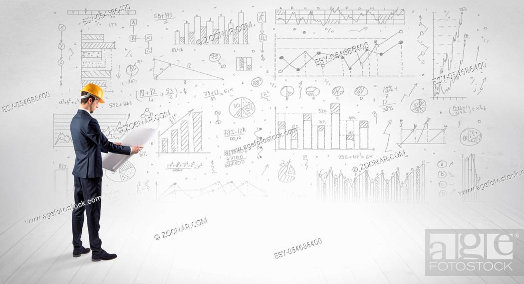 Stock Photo: Engineer with construction helmet holding a plan and standing with graphs, charts and reports on the background.
